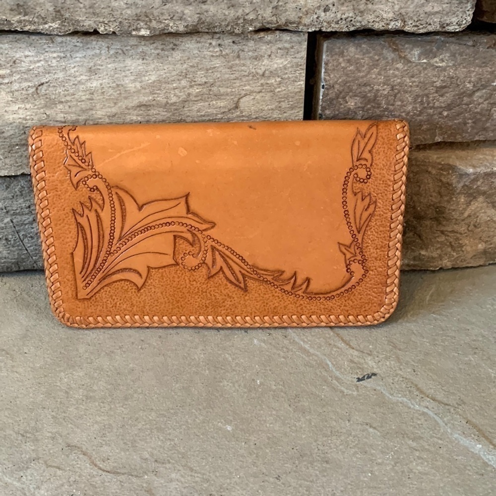 Hand tooled leather wallet.